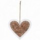 Heart hanging in white wood and logs of wood