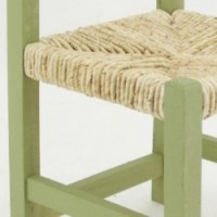 Children's wooden chair and green straw