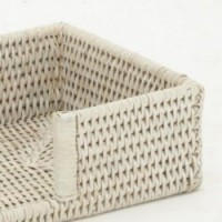 White patinated rattan towel basket