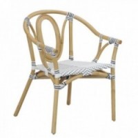 Garden armchair in natural rattan sitting in black and white synthetic rattan